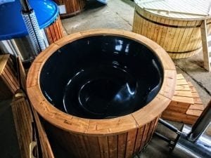 Outdoor hot tub with wood fired external burner black fiberglass thermo wood 5