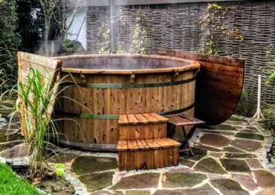 Wood fired hot tub with snorkel heater